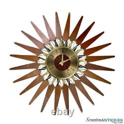 Mid-Century Modern Atomic Walnut Sunburst Sculpted Wall Hanging Clock