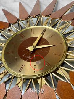 Mid-Century Modern Atomic Walnut Sunburst Sculpted Wall Hanging Clock